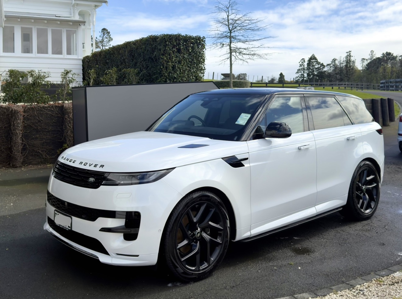 White Range Rover Sport with a glossy ceramic finish.