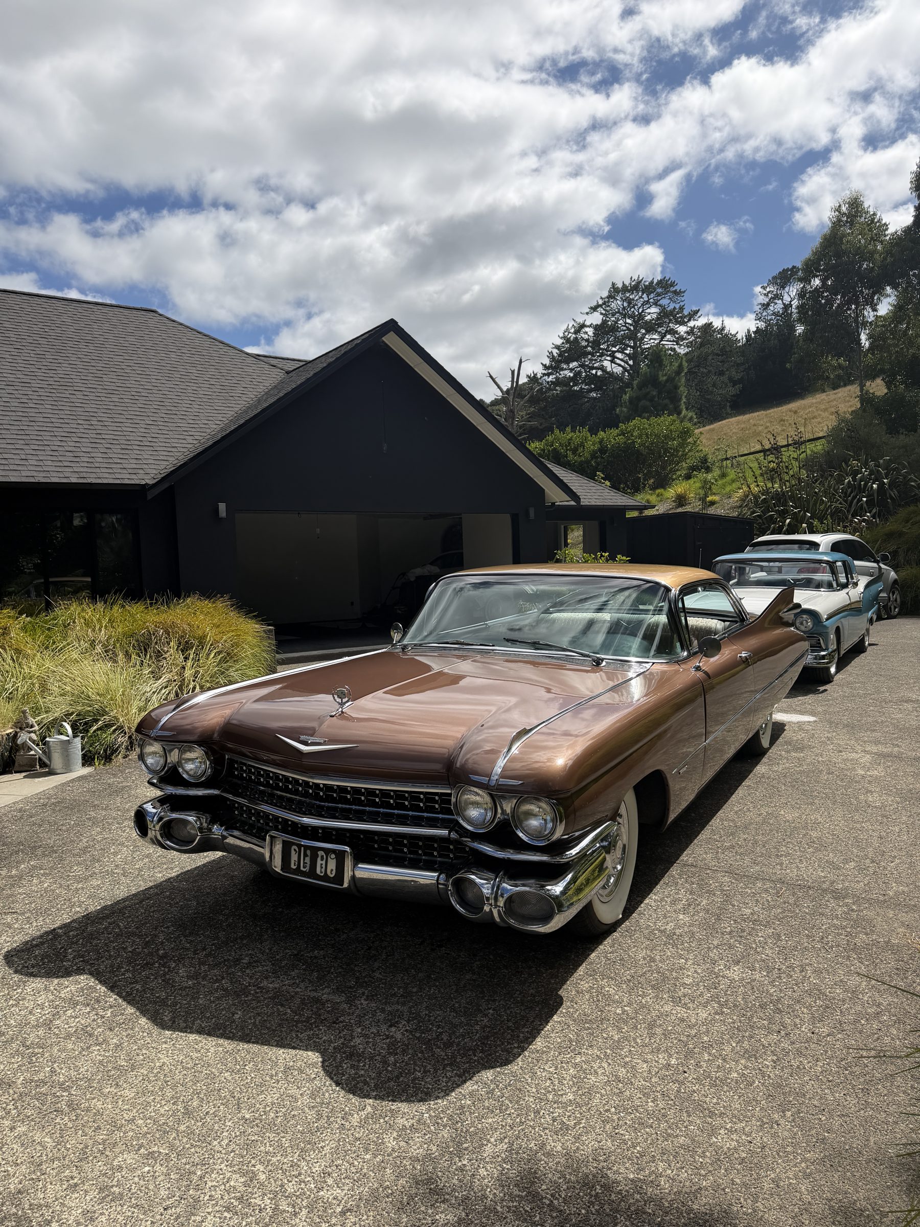 Classic Cadillac on a driveway.